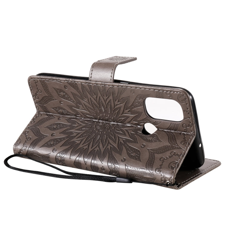 For OnePlus Nord N100 Sun Embossing Pattern Horizontal Flip Leather Case with Card Slot & Holder & Wallet & Lanyard