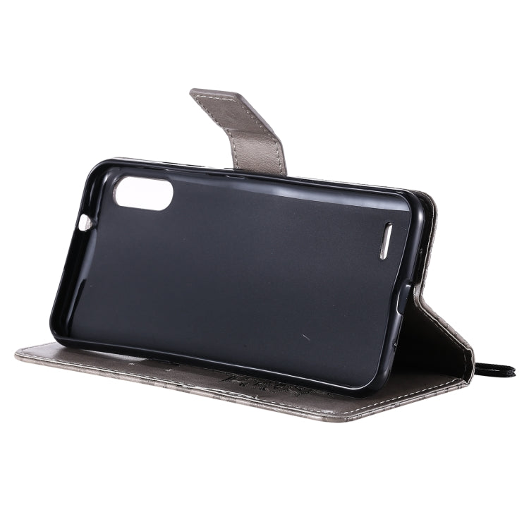 For LG K22 / K22 Plus Sun Embossing Pattern Horizontal Flip Leather Case with Card Slot & Holder & Wallet & Lanyard