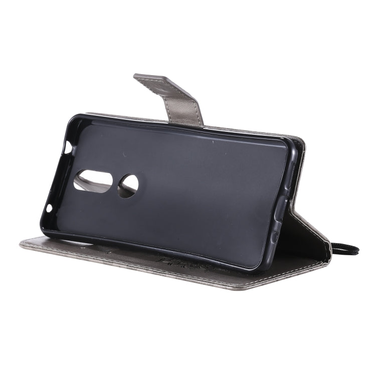 For Nokia 2.4 Sun Embossing Pattern Horizontal Flip Leather Case with Card Slot & Holder & Wallet & Lanyard