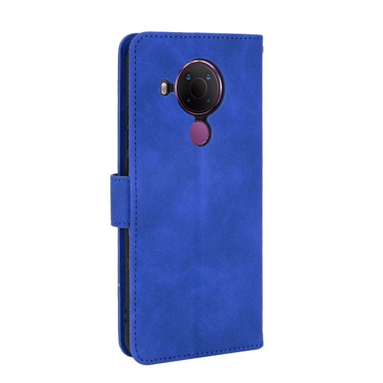For Nokia 5.4 Solid Color Skin Feel Magnetic Buckle Horizontal Flip Calf Texture PU Leather Case with Holder & Card Slots & Wallet