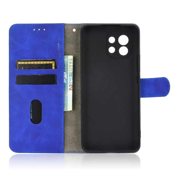 For Xiaomi Mi 11 Solid Color Skin Feel Magnetic Buckle Horizontal Flip Calf Texture PU Leather Case with Holder & Card Slots & Wallet