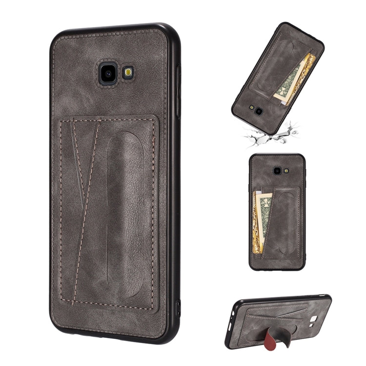 For Galaxy J4+ Shockproof PC + PU Protective Case with Spring Holder & Card Slot