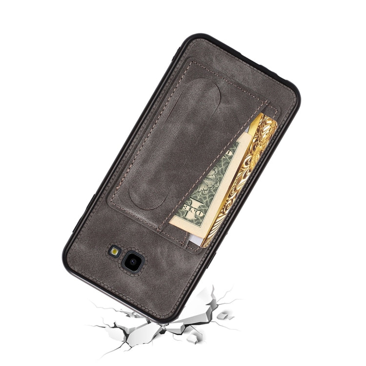 For Galaxy J4+ Shockproof PC + PU Protective Case with Spring Holder & Card Slot