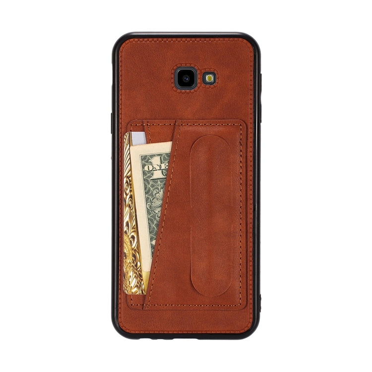 For Galaxy J4+ Shockproof PC + PU Protective Case with Spring Holder & Card Slot