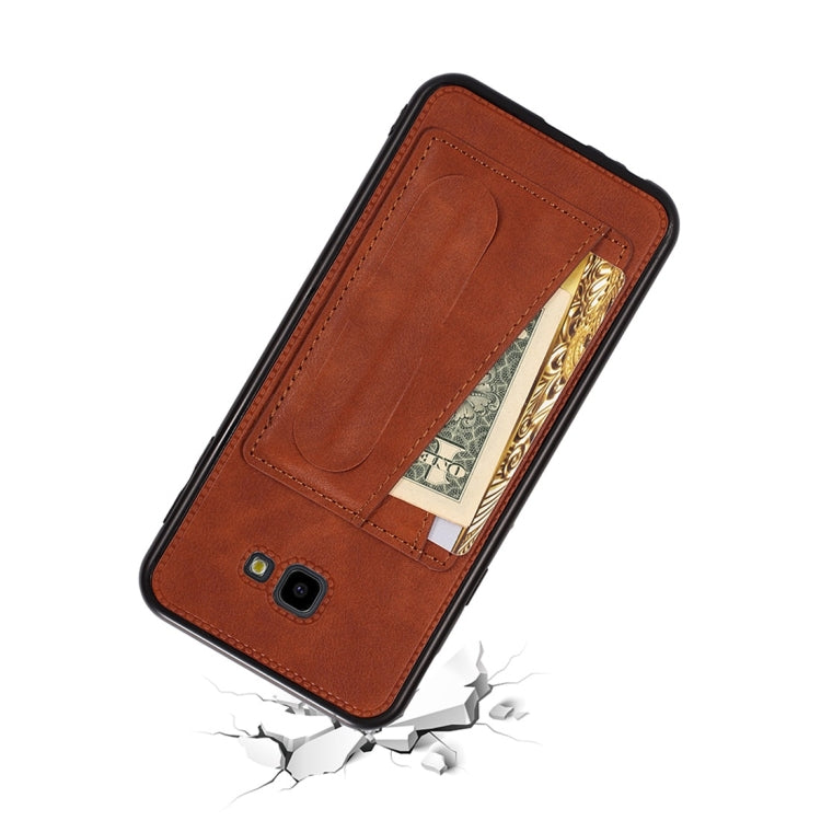 For Galaxy J4+ Shockproof PC + PU Protective Case with Spring Holder & Card Slot
