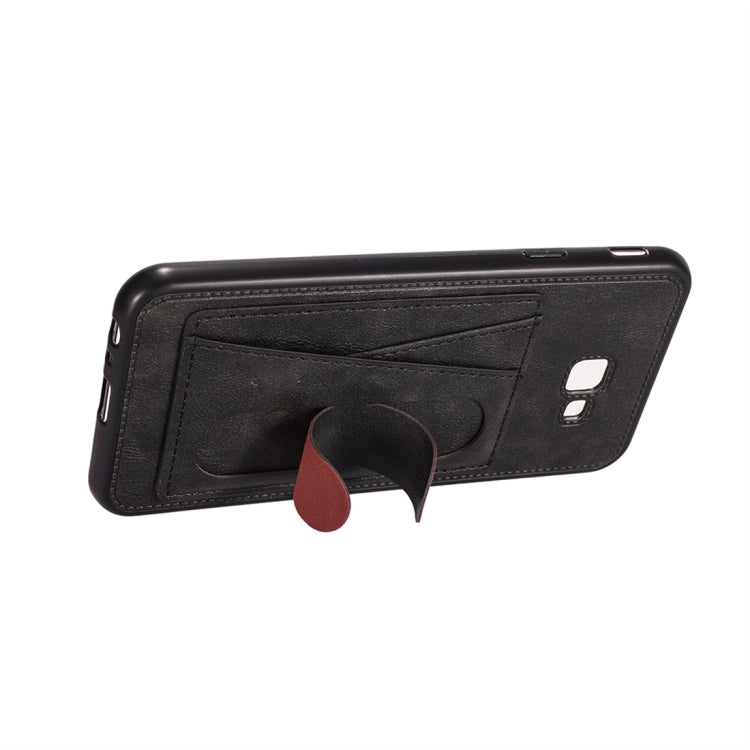 For Galaxy J4+ Shockproof PC + PU Protective Case with Spring Holder & Card Slot
