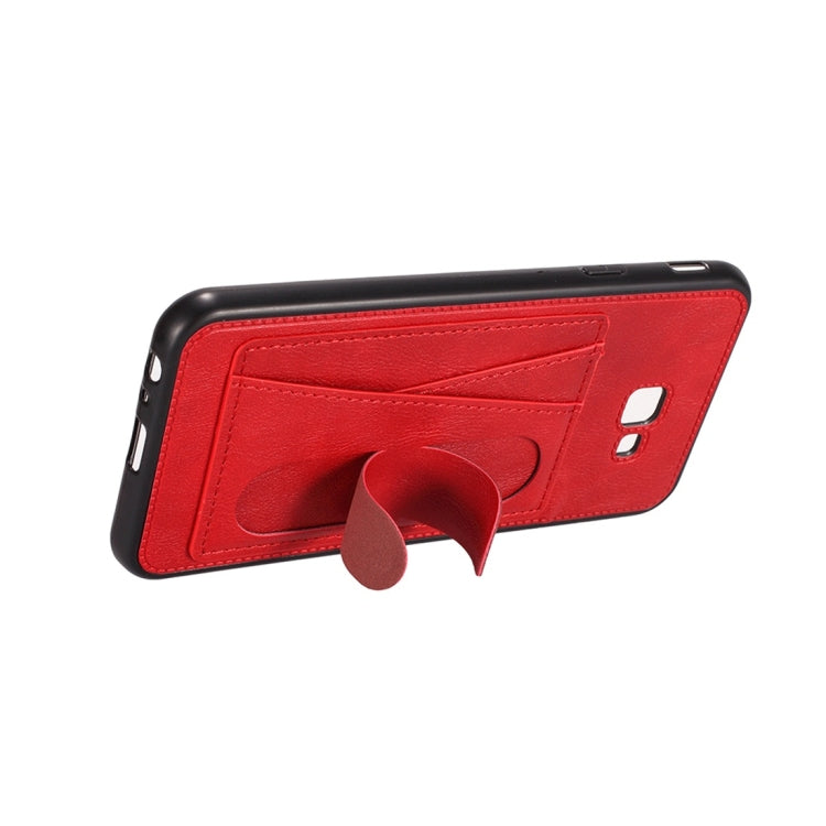 For Galaxy J4+ Shockproof PC + PU Protective Case with Spring Holder & Card Slot