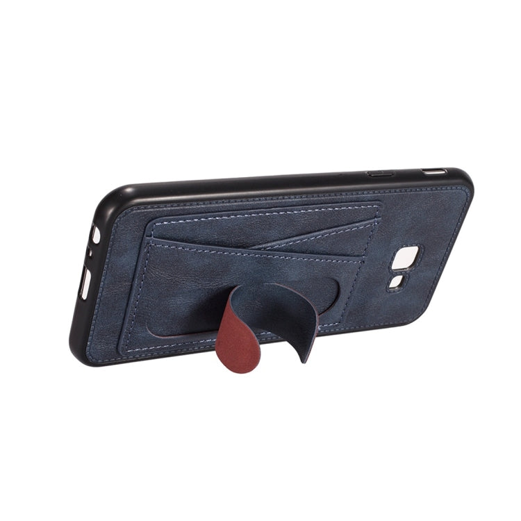For Galaxy J4+ Shockproof PC + PU Protective Case with Spring Holder & Card Slot