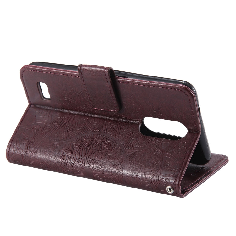 For LG K4 (2017) (US Version) Totem Flower Embossed Horizontal Flip TPU + PU Leather Case with Holder & Card Slots & Wallet