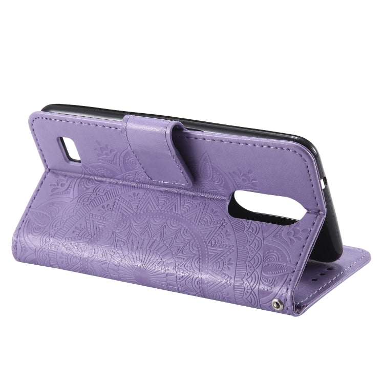 For LG K4 (2017) (US Version) Totem Flower Embossed Horizontal Flip TPU + PU Leather Case with Holder & Card Slots & Wallet