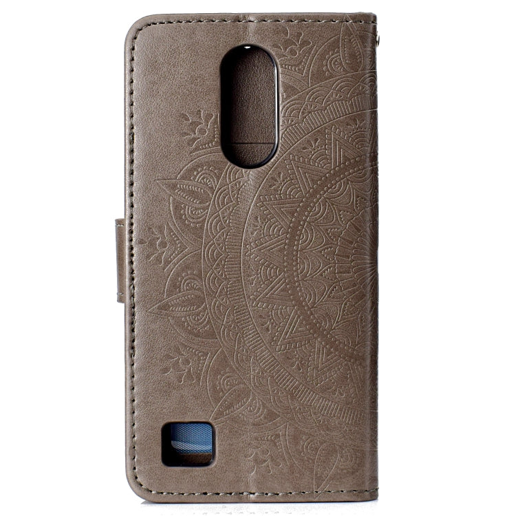 For LG K10 (2017) (EU / US Version)  Totem Flower Embossed Horizontal Flip TPU + PU Leather Case with Holder & Card Slots & Wallet