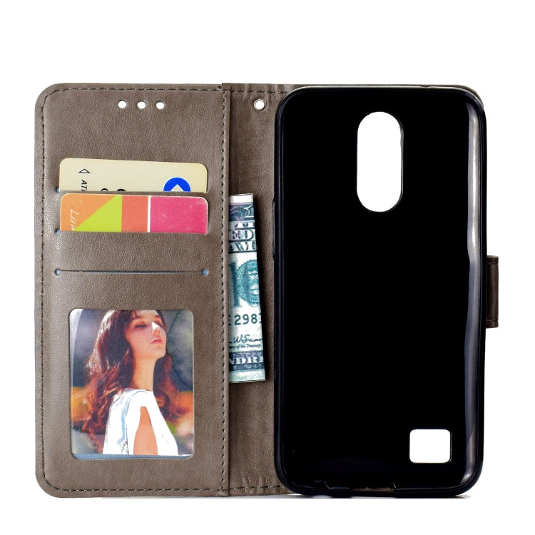 For LG K10 (2017) (EU / US Version)  Totem Flower Embossed Horizontal Flip TPU + PU Leather Case with Holder & Card Slots & Wallet