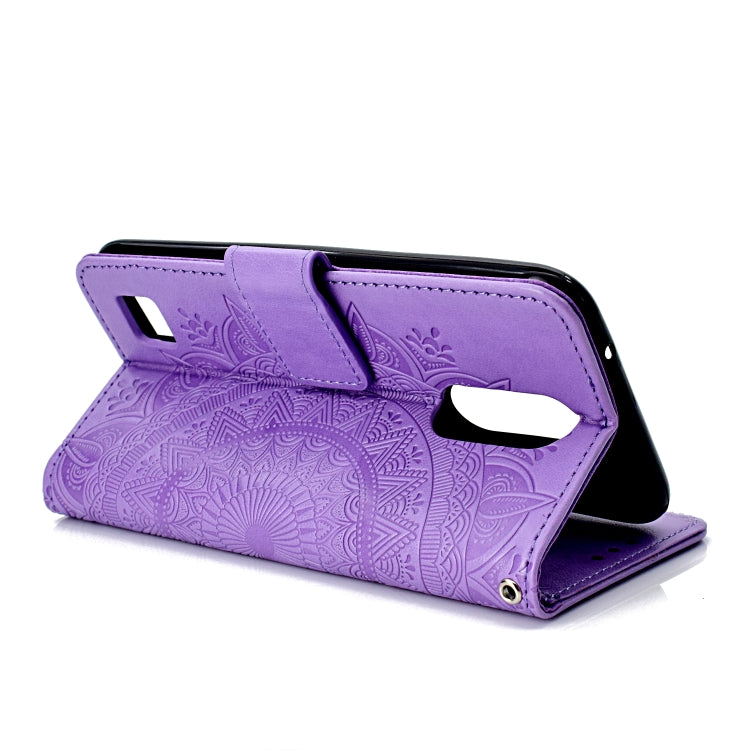 For LG K10 (2017) (EU / US Version)  Totem Flower Embossed Horizontal Flip TPU + PU Leather Case with Holder & Card Slots & Wallet