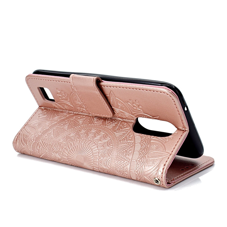 For LG K10 (2017) (EU / US Version)  Totem Flower Embossed Horizontal Flip TPU + PU Leather Case with Holder & Card Slots & Wallet