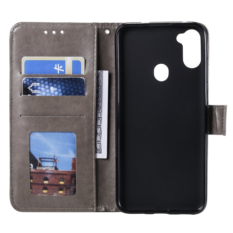 For Samsung Galaxy A11 Totem Flower Embossed Horizontal Flip TPU + PU Leather Case with Holder & Card Slots & Wallet