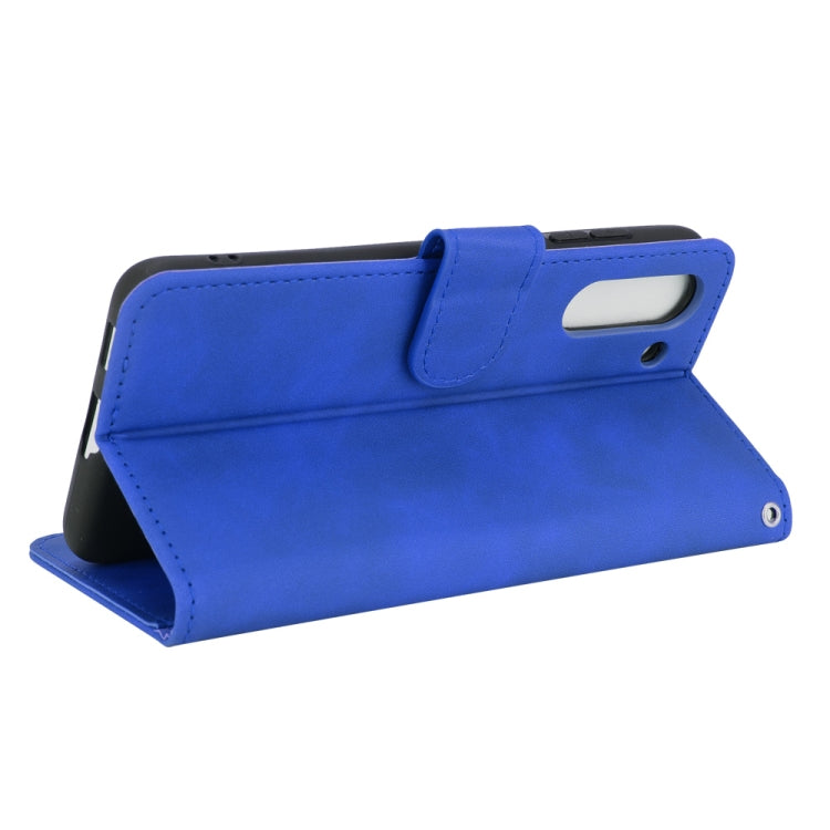 For Samsung Galaxy S21 FE Solid Color Skin Feel Magnetic Buckle Horizontal Flip Calf Texture PU Leather Case with Holder & Card Slots & Wallet