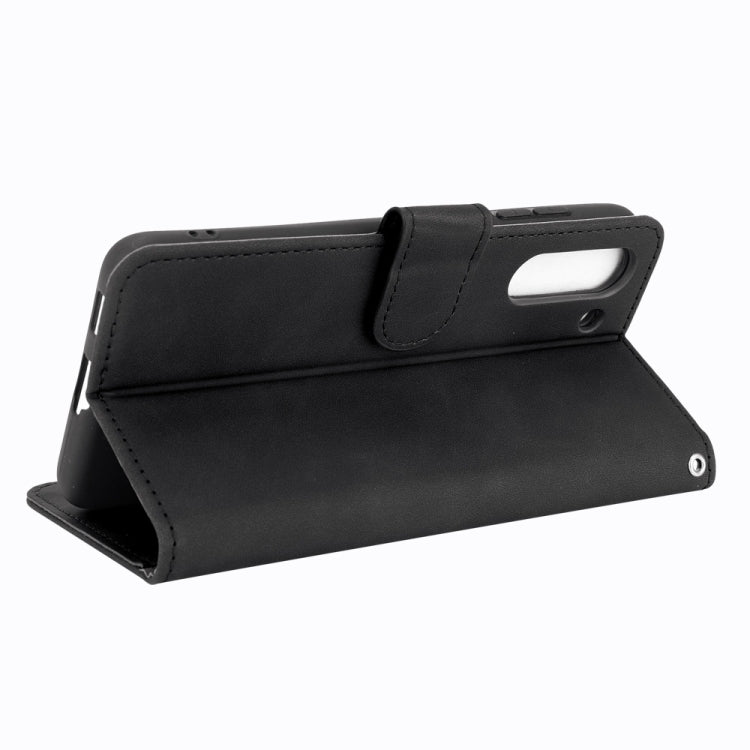 For Samsung Galaxy S21 FE Solid Color Skin Feel Magnetic Buckle Horizontal Flip Calf Texture PU Leather Case with Holder & Card Slots & Wallet