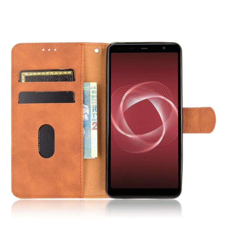 For Fujitsu Be4 Plus F-41B Solid Color Skin Feel Magnetic Buckle Horizontal Flip Calf Texture PU Leather Case with Holder & Card Slots & Wallet