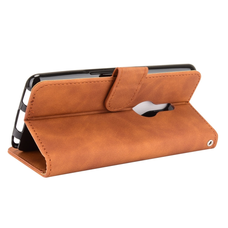 For Fujitsu Be4 Plus F-41B Solid Color Skin Feel Magnetic Buckle Horizontal Flip Calf Texture PU Leather Case with Holder & Card Slots & Wallet