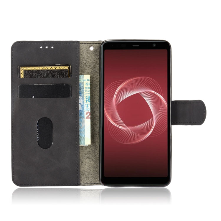 For Fujitsu Be4 Plus F-41B Solid Color Skin Feel Magnetic Buckle Horizontal Flip Calf Texture PU Leather Case with Holder & Card Slots & Wallet