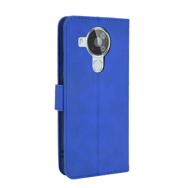 For Nokia 7.3 Solid Color Skin Feel Magnetic Buckle Horizontal Flip Calf Texture PU Leather Case with Holder & Card Slots & Wallet