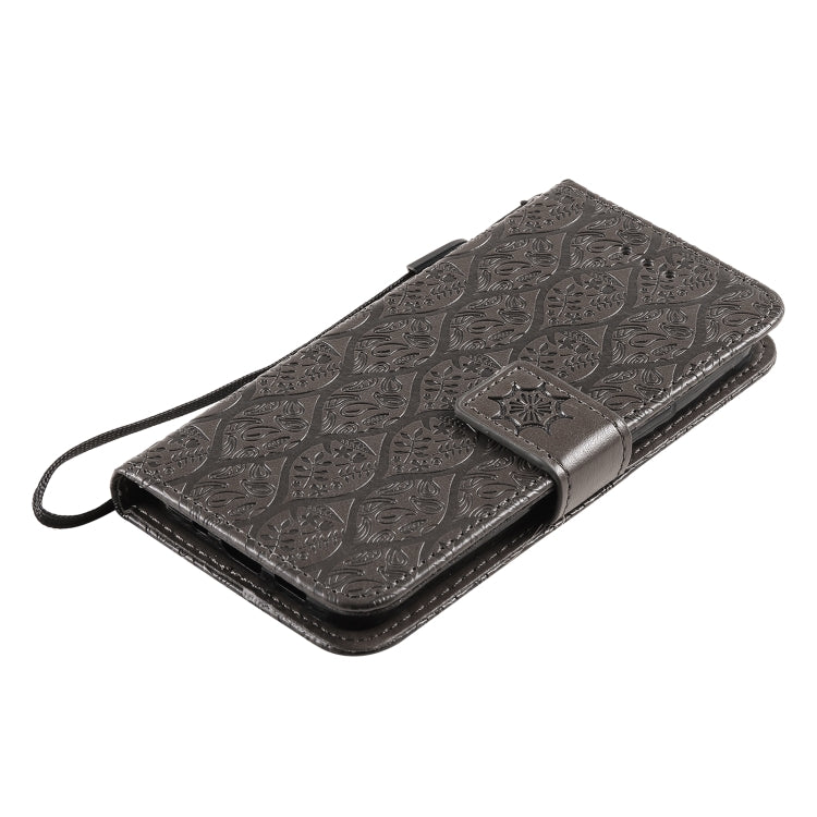 For iPhone 13 Pressed Printing Rattan Flower Pattern Horizontal Flip PU Leather Case with Holder & Card Slots & Wallet & Photo Frame