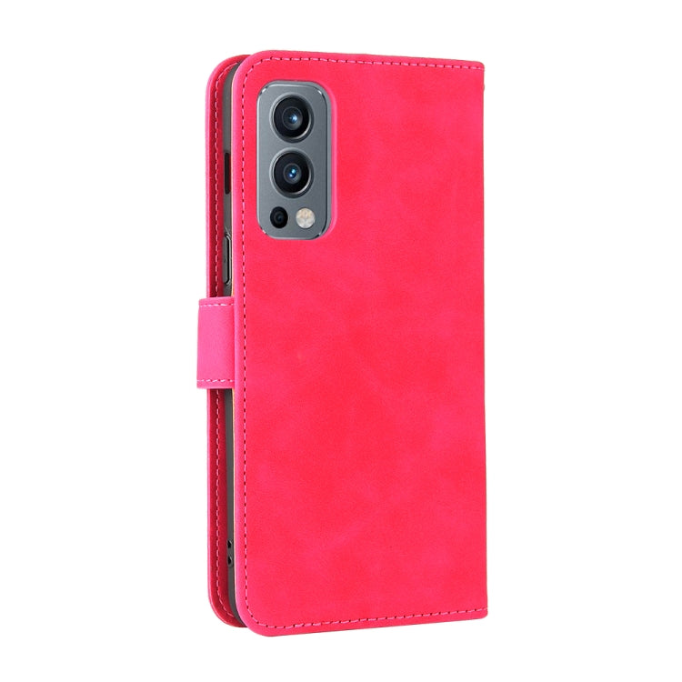 For OnePlus Nord 2 5G Solid Color Skin Feel Magnetic Buckle Horizontal Flip Calf Texture PU Leather Case with Holder & Card Slots & Wallet
