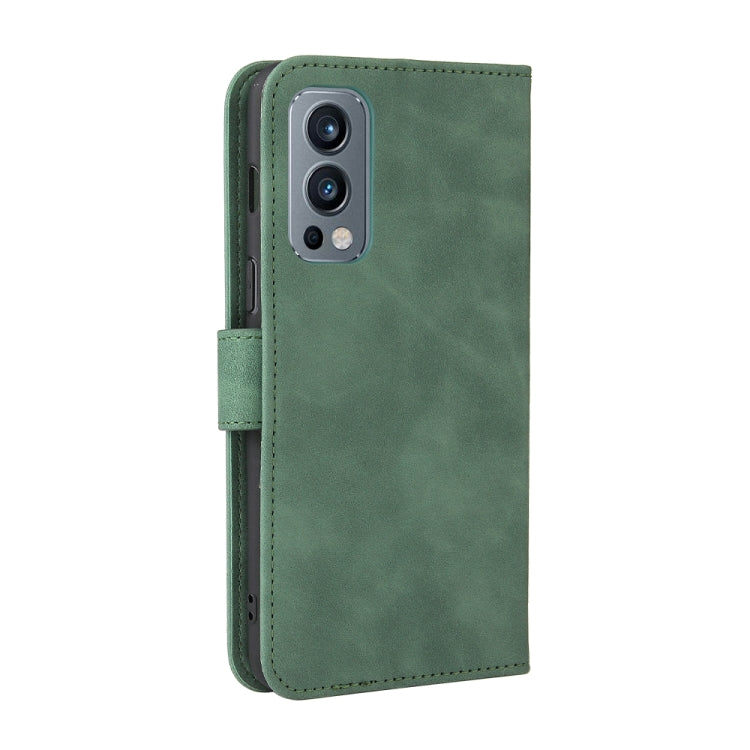 For OnePlus Nord 2 5G Solid Color Skin Feel Magnetic Buckle Horizontal Flip Calf Texture PU Leather Case with Holder & Card Slots & Wallet