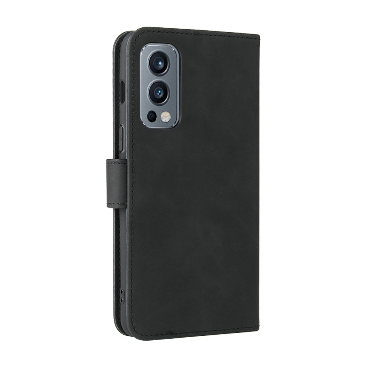 For OnePlus Nord 2 5G Solid Color Skin Feel Magnetic Buckle Horizontal Flip Calf Texture PU Leather Case with Holder & Card Slots & Wallet