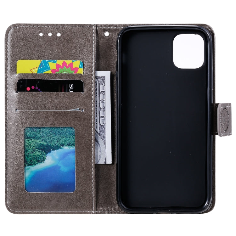 For iPhone 14 Pro Max Totem Flower Embossed Leather Case
