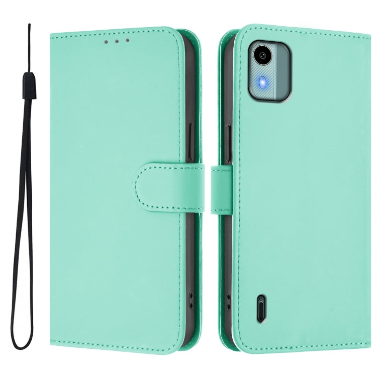 For Nokia C12 Skin Feel Solid Color Leather Phone Case with Lanyard