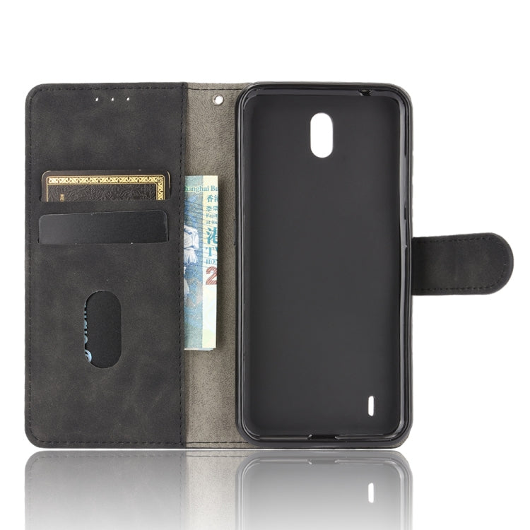 For Nokia C2 Solid Color Skin Feel Magnetic Buckle Horizontal Flip Calf Texture PU Leather Case with Holder & Card Slots & Wallet