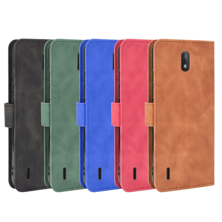 For Nokia C2 Solid Color Skin Feel Magnetic Buckle Horizontal Flip Calf Texture PU Leather Case with Holder & Card Slots & Wallet