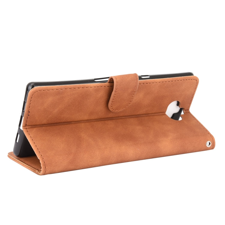 For Sony Xperia 10 Solid Color Skin Feel Magnetic Buckle Horizontal Flip Calf Texture PU Leather Case with Holder & Card Slots & Wallet