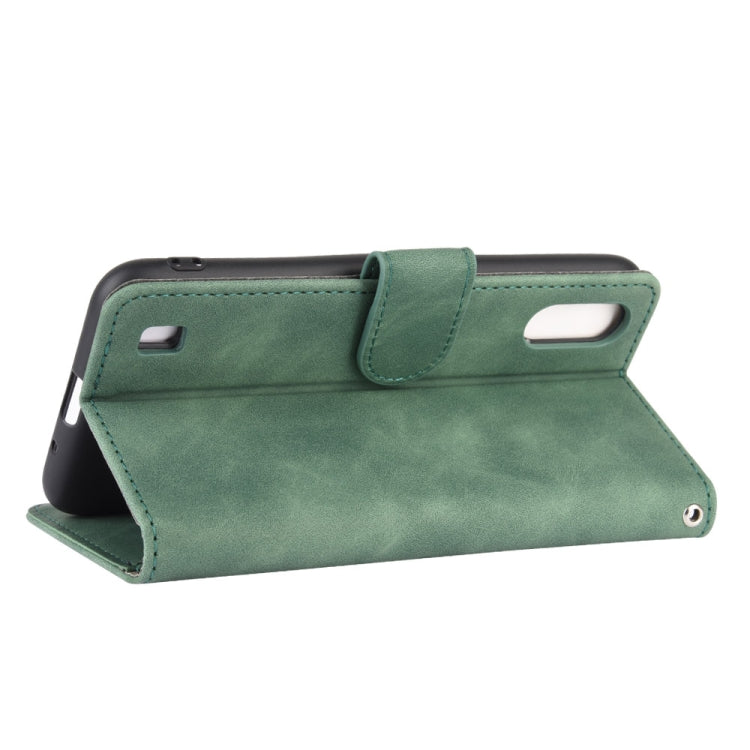 For Samsung Galaxy A01 (Global Version) Solid Color Skin Feel Magnetic Buckle Horizontal Flip Calf Texture PU Leather Case with Holder & Card Slots & Wallet