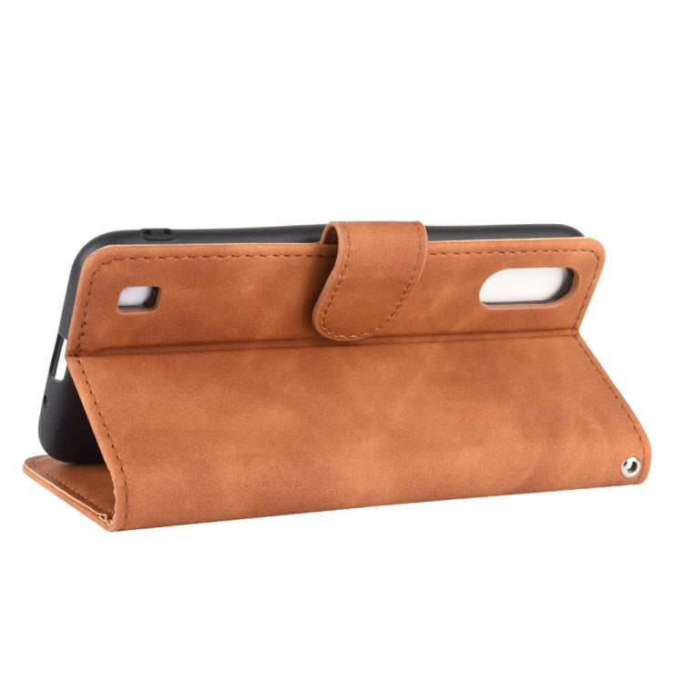 For Samsung Galaxy A01 (Global Version) Solid Color Skin Feel Magnetic Buckle Horizontal Flip Calf Texture PU Leather Case with Holder & Card Slots & Wallet
