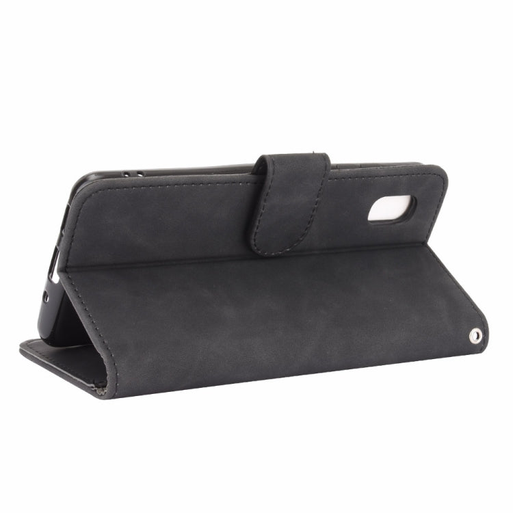 For Samsung Galaxy A20 (Japanese Version) Solid Color Skin Feel Magnetic Buckle Horizontal Flip Calf Texture PU Leather Case with Holder & Card Slots & Wallet