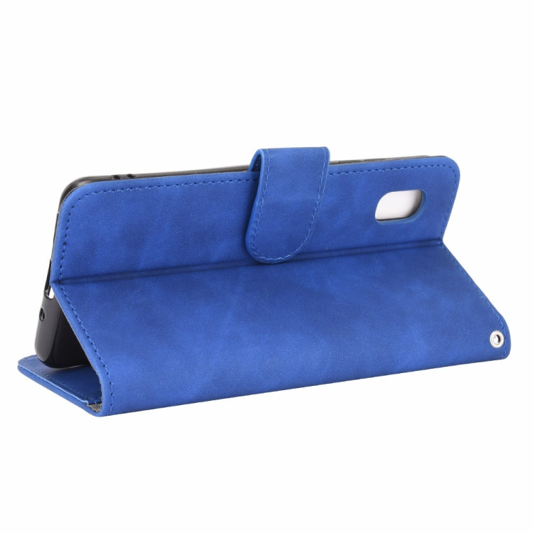 For Samsung Galaxy A20 (Japanese Version) Solid Color Skin Feel Magnetic Buckle Horizontal Flip Calf Texture PU Leather Case with Holder & Card Slots & Wallet