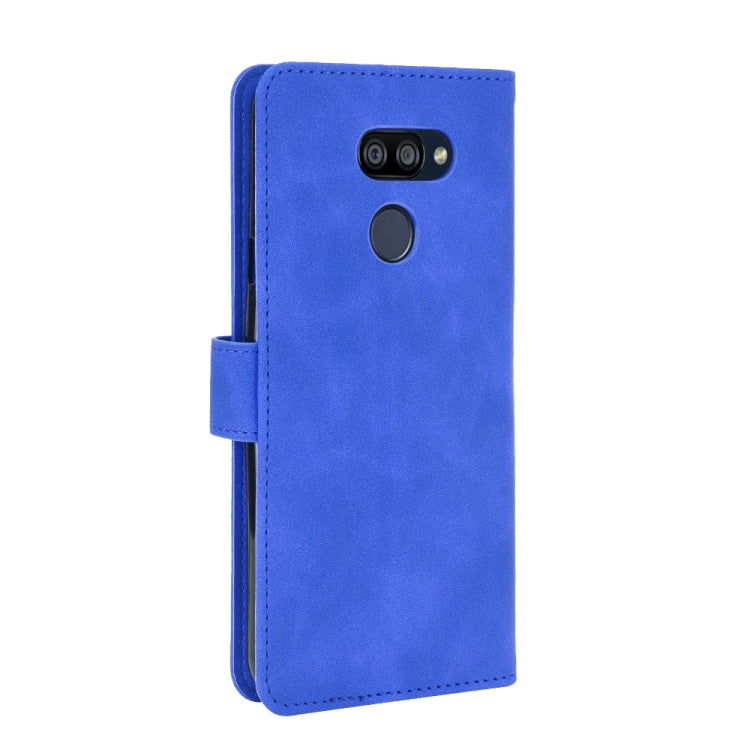 For LG K40S Solid Color Skin Feel Magnetic Buckle Horizontal Flip Calf Texture PU Leather Case with Holder & Card Slots & Wallet