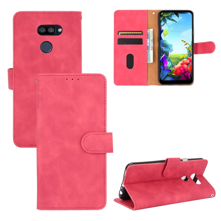 For LG K40S Solid Color Skin Feel Magnetic Buckle Horizontal Flip Calf Texture PU Leather Case with Holder & Card Slots & Wallet
