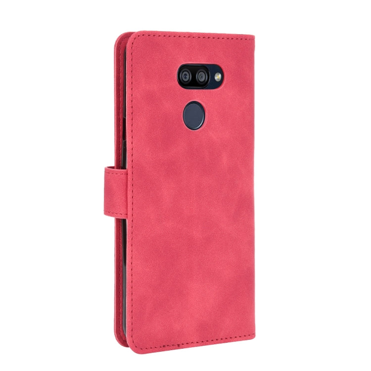 For LG K40S Solid Color Skin Feel Magnetic Buckle Horizontal Flip Calf Texture PU Leather Case with Holder & Card Slots & Wallet