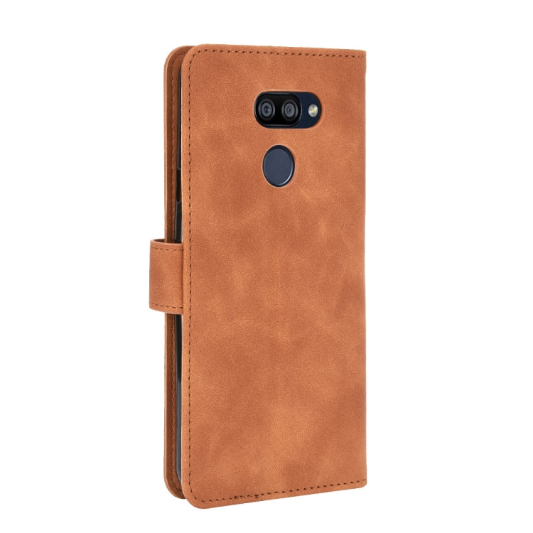 For LG K40S Solid Color Skin Feel Magnetic Buckle Horizontal Flip Calf Texture PU Leather Case with Holder & Card Slots & Wallet
