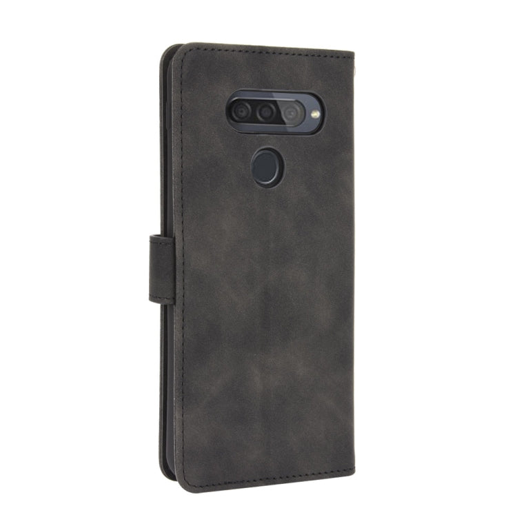 For LG Q70 Solid Color Skin Feel Magnetic Buckle Horizontal Flip Calf Texture PU Leather Case with Holder & Card Slots & Wallet