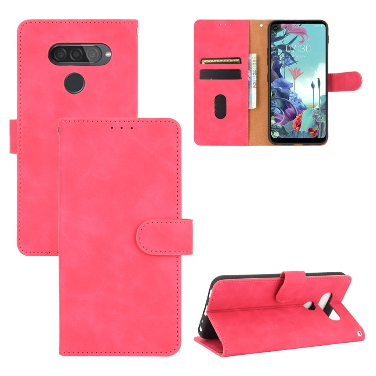 For LG Q70 Solid Color Skin Feel Magnetic Buckle Horizontal Flip Calf Texture PU Leather Case with Holder & Card Slots & Wallet