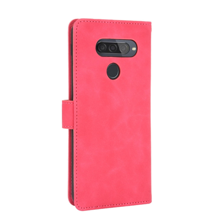 For LG Q70 Solid Color Skin Feel Magnetic Buckle Horizontal Flip Calf Texture PU Leather Case with Holder & Card Slots & Wallet