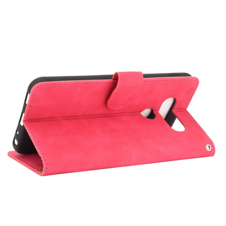 For LG Q70 Solid Color Skin Feel Magnetic Buckle Horizontal Flip Calf Texture PU Leather Case with Holder & Card Slots & Wallet