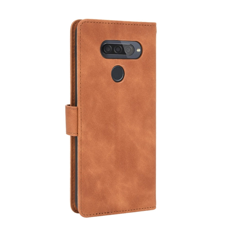 For LG Q70 Solid Color Skin Feel Magnetic Buckle Horizontal Flip Calf Texture PU Leather Case with Holder & Card Slots & Wallet