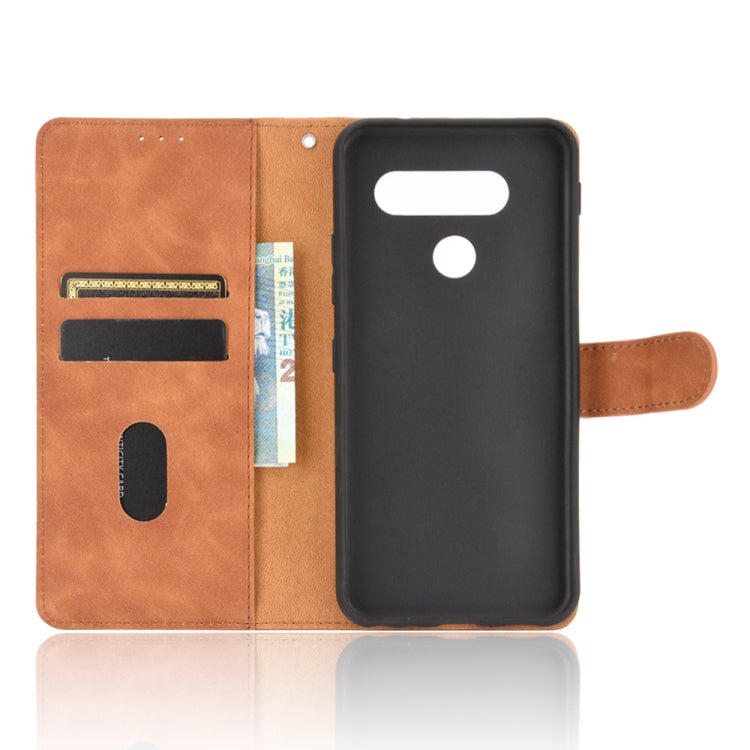 For LG Q70 Solid Color Skin Feel Magnetic Buckle Horizontal Flip Calf Texture PU Leather Case with Holder & Card Slots & Wallet