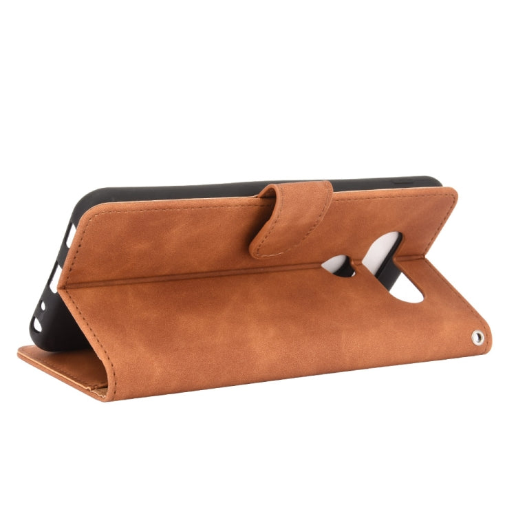 For LG Q70 Solid Color Skin Feel Magnetic Buckle Horizontal Flip Calf Texture PU Leather Case with Holder & Card Slots & Wallet