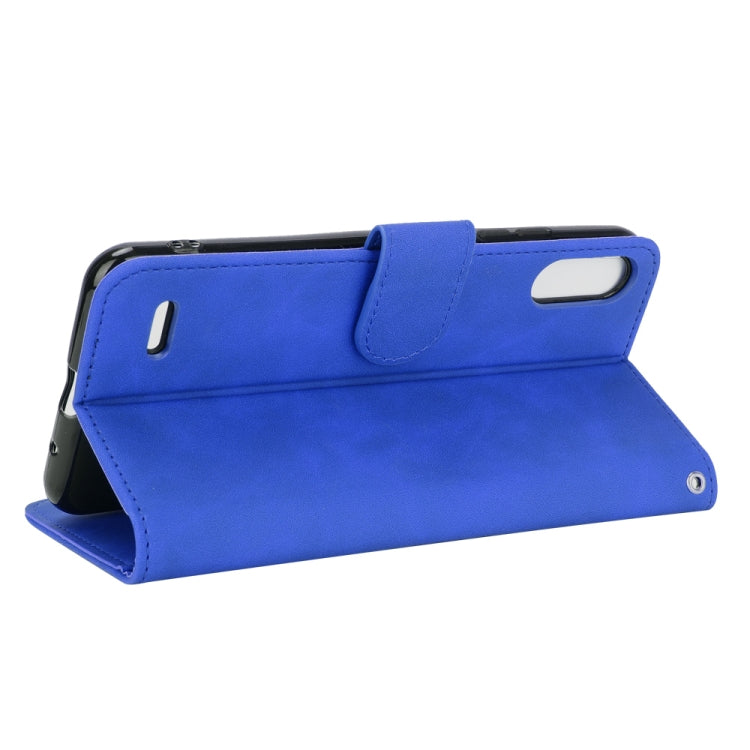 For LG K22 Solid Color Skin Feel Magnetic Buckle Horizontal Flip Calf Texture PU Leather Case with Holder & Card Slots & Wallet